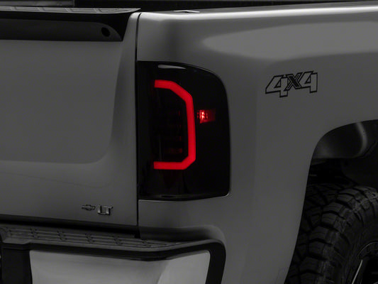 Raxiom 07-14 Chevrolet Silverado 1500 Axial Series LED Tail Lights- Black Housing (Smoked Lens)